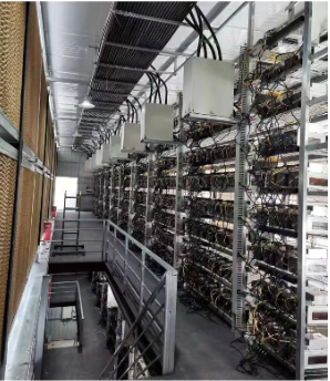 Upper-level view of mining machine racks and wiring